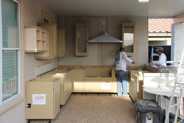outdoor kitchen cabinets are partially installed